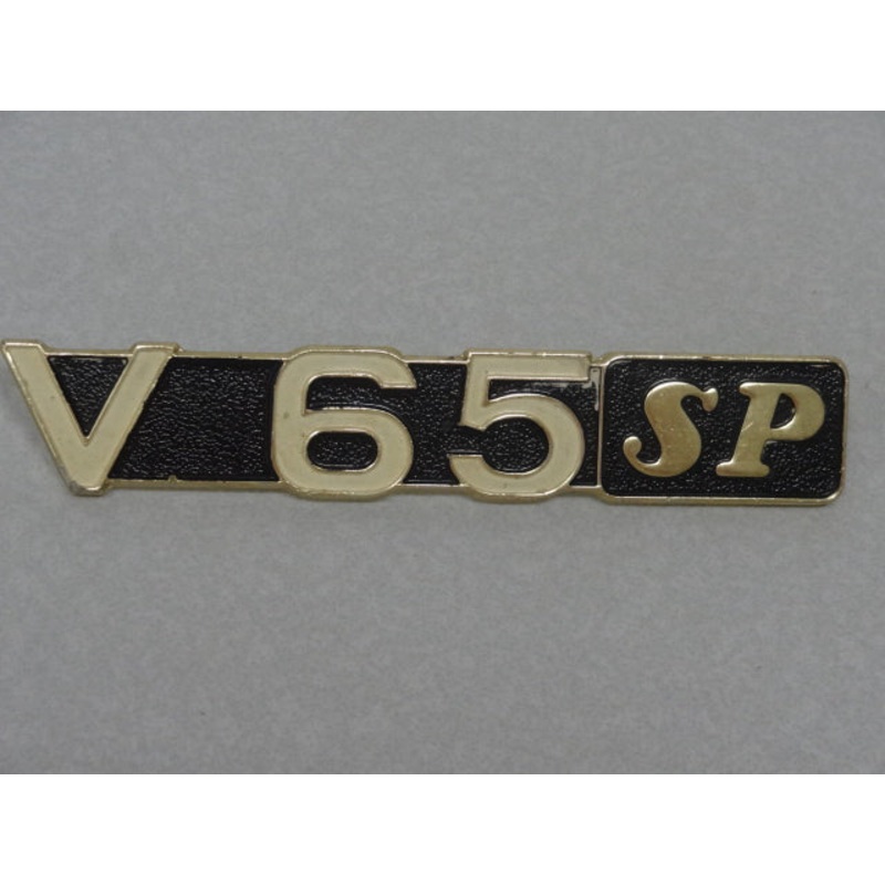 V65SP BADGE (#19922065)